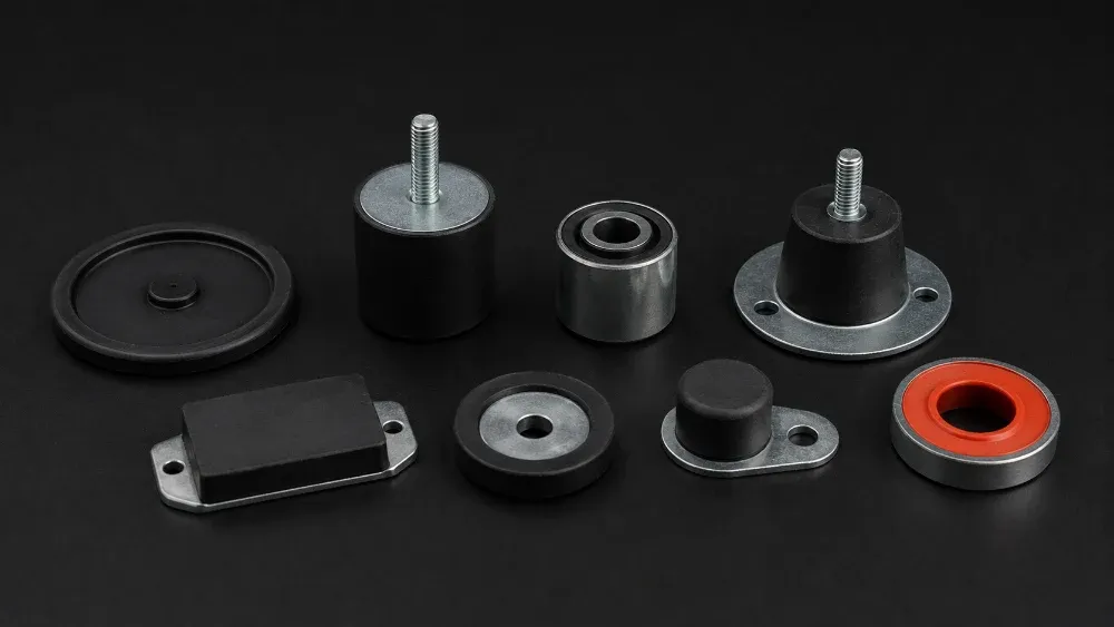Rubber-to-metal bonded parts: an encapsulated irrigation valve disc, stud mounts, bonded bushes, pads and a bonded sealing ring on steel inserts
